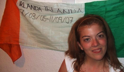 Alicia in front of an Irish flag