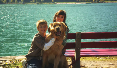 Celeste with her host child and a dog