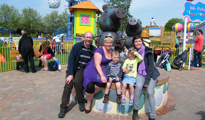 Karen and her family on a playground
