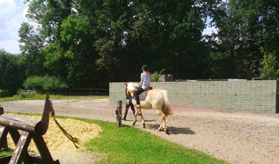 Catherine's riding a horse