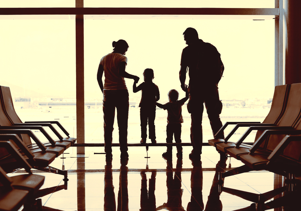 A family waits for their new au pair at the airport.