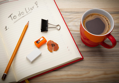 To do list and a coffee cup