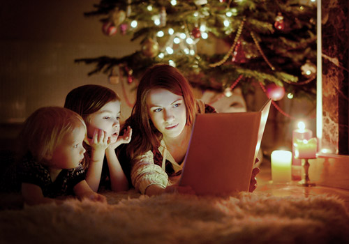 Reading a book with kids at Christmastime