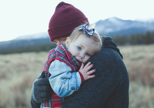 Father holding his daughter