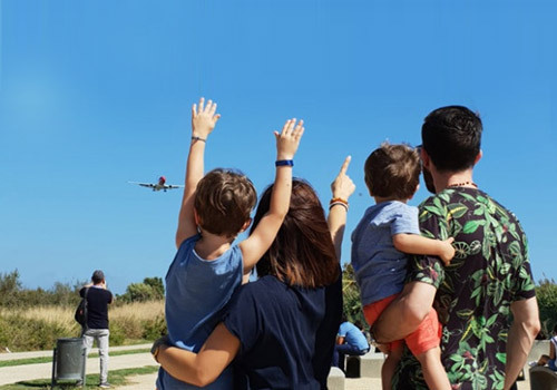 A family with two children looking to the horizon