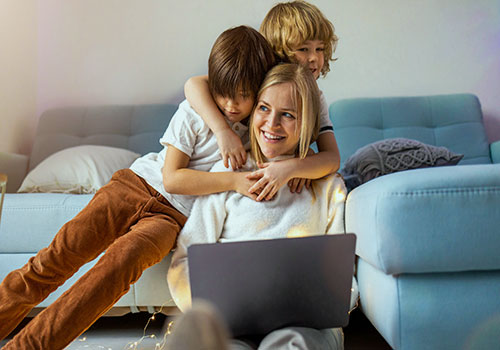 Mom working at home with her kids